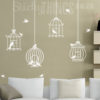 The Bird Cage Wall Art Decal Sticker is 4 bird cages hanging with flying and sitting birds.