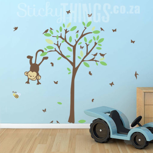 The Monkey Tree Nursery Wall Decal is a tree with leaves and birds plus a cute monkey hanging off the tree.