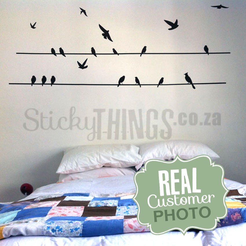 Birds on a Wire Wall Sticker above a bed in a bedroom