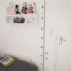 The Growth Chart Wall Sticker is stuck to a wall in a kids room