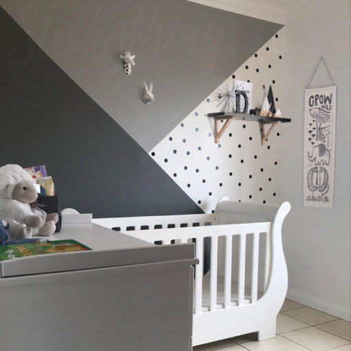 Mini Dot Decal Set incorporated into a triangle section of the wall in a nursery