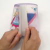 Hand showing the Peel and Stick Princess Fairy Purple Border