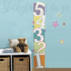 Patterned Numbers Growth Chart Decal on a blue wall