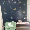 Small Rocket Dog Wall Stickers on Navy Wallpaper on a wall