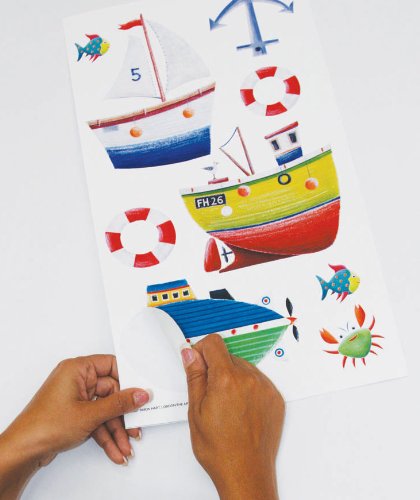 Hand showing the easy Peel and Stick Boat and Nautical Ship Wall Stickers