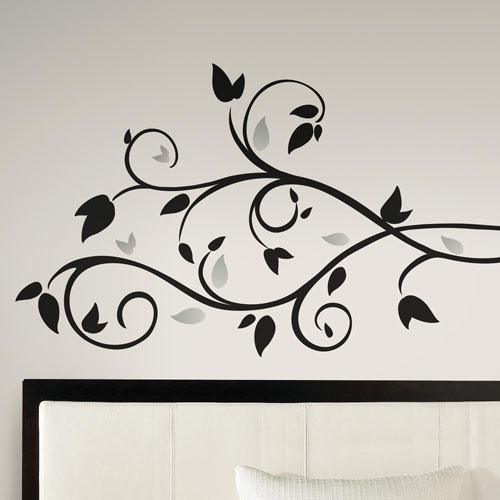 Shiny Leaves Branch Wall Sticker above a Headboard