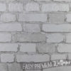 Realistic looking embossed white bricks wallpaper
