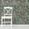 Birds and Fruit wallpaper on a wall behind a chair