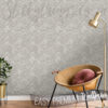 Grey Geometric Plaster Wallpaper on a wall behind a plant, a chair and a lamp