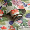 A roll of floral and fruit cream wallpaper