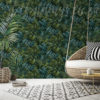 The Handpainted Leaf Wallpaper on a wall behind a lounge swing chair