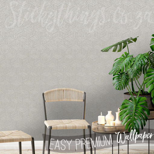 Grey Grasscloth Effect Wallpaper on a wall behind a chair and a small plant