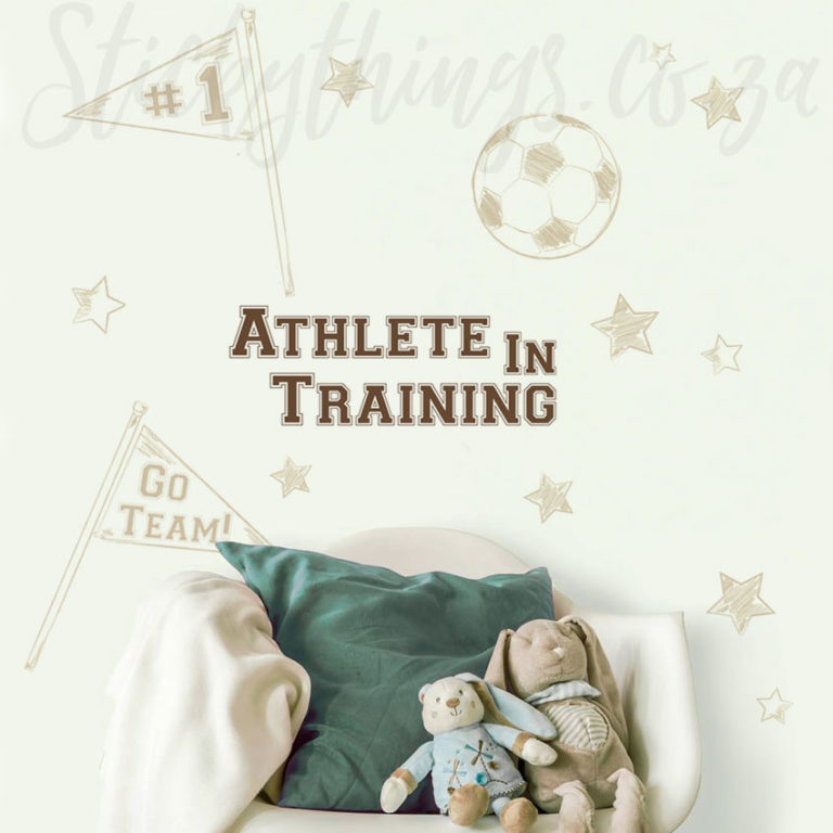 Athlete in Training Wall Decal on a wall behind a chair with soft bunnies on it.