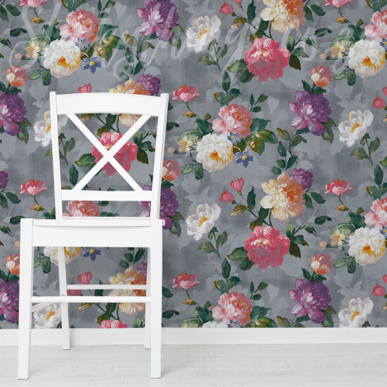Grey Handpainted Roses Wallpaper on a wall behind a white chair.