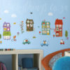 Happy Town Peel and Stick Wall Decals on a sky blue playroom wall