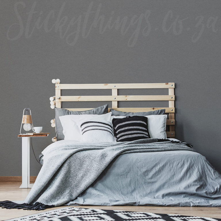 Light Grey Fabric Effect Wallpaper on a bedroom wall behind a headboard
