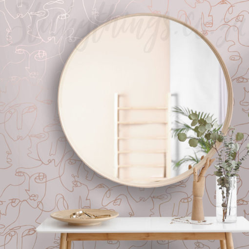 Pink Face Line Drawing Wallpaper on a wall behind a round mirror