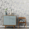 Taupe Floral Concrete Wallpaper on a wall