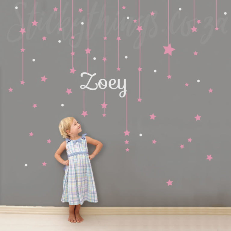Stars Name Wall Decal fetauring a little girl looking at her name on the wall