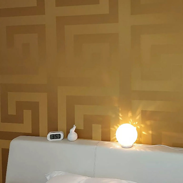 Versace Silver Gold Wallpaper on a wall