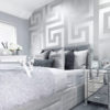 Versace Silver Greca Wallpaper on a bedroom wall