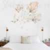 Palm Orchid Wall Decals on a bedroom wall above a bed.