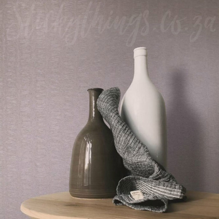 Taupe Veluto Wallpaper on a wall
