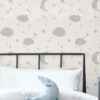 Grey Clouds Moons and Stars Wallpaper on a wall
