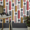 Mustard Grey and Red Geo Wallpaper on a wall